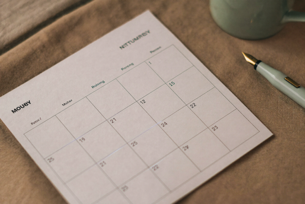 A blank calendar page beside a mug and pen, suggesting the multi-week TRT response timeline