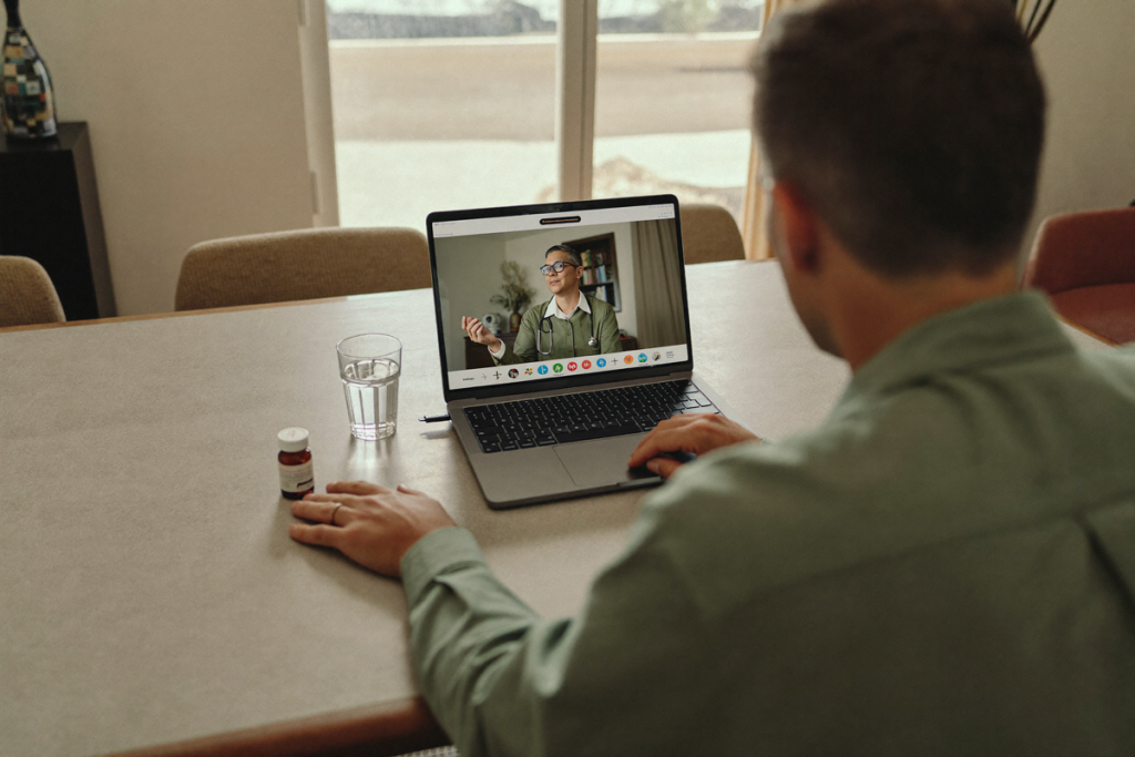 Man having a telehealth appointment at home to discuss an enclomiphene prescription